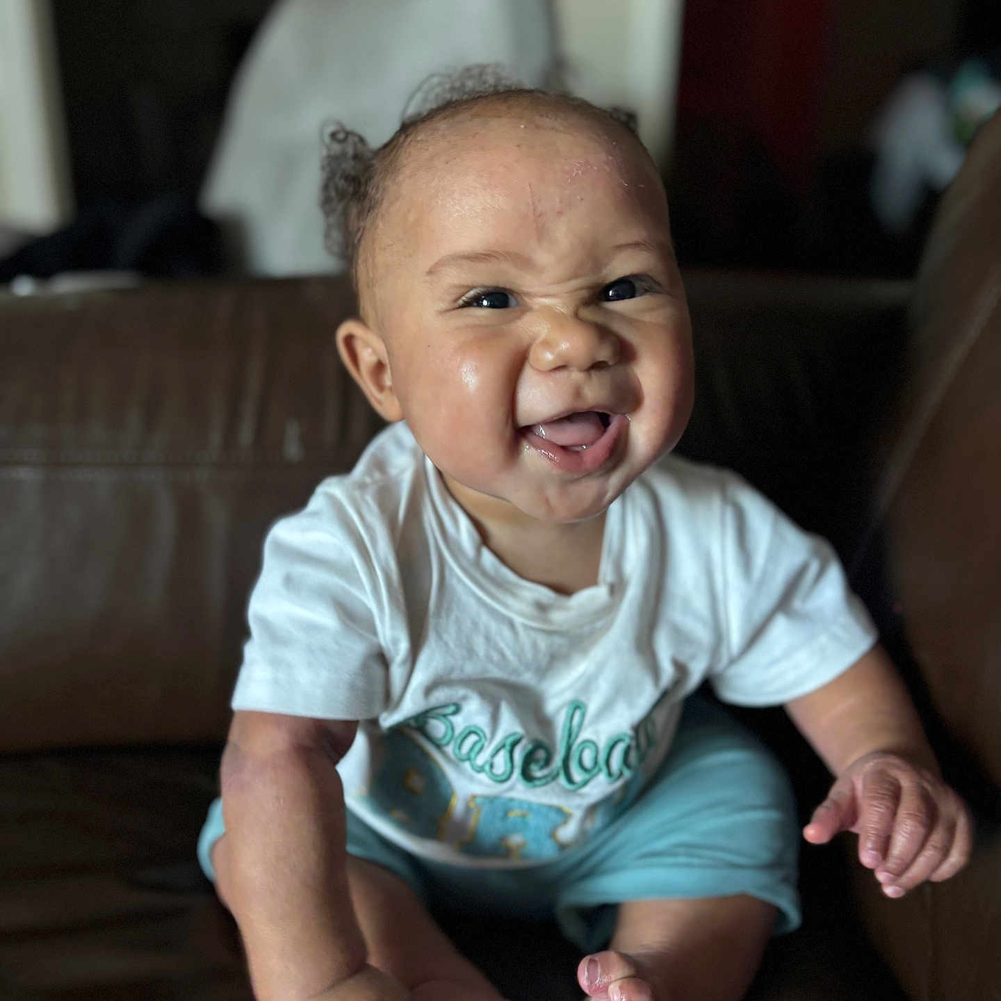 Braxxton is registered to the contest to win money with this photo: architecture, baby, babylaughing, bodypart, building, clothing, couch, face, finger, furniture, hand, happy, head, laughing, person, photography, portrait, sitting, smile, t_shirt