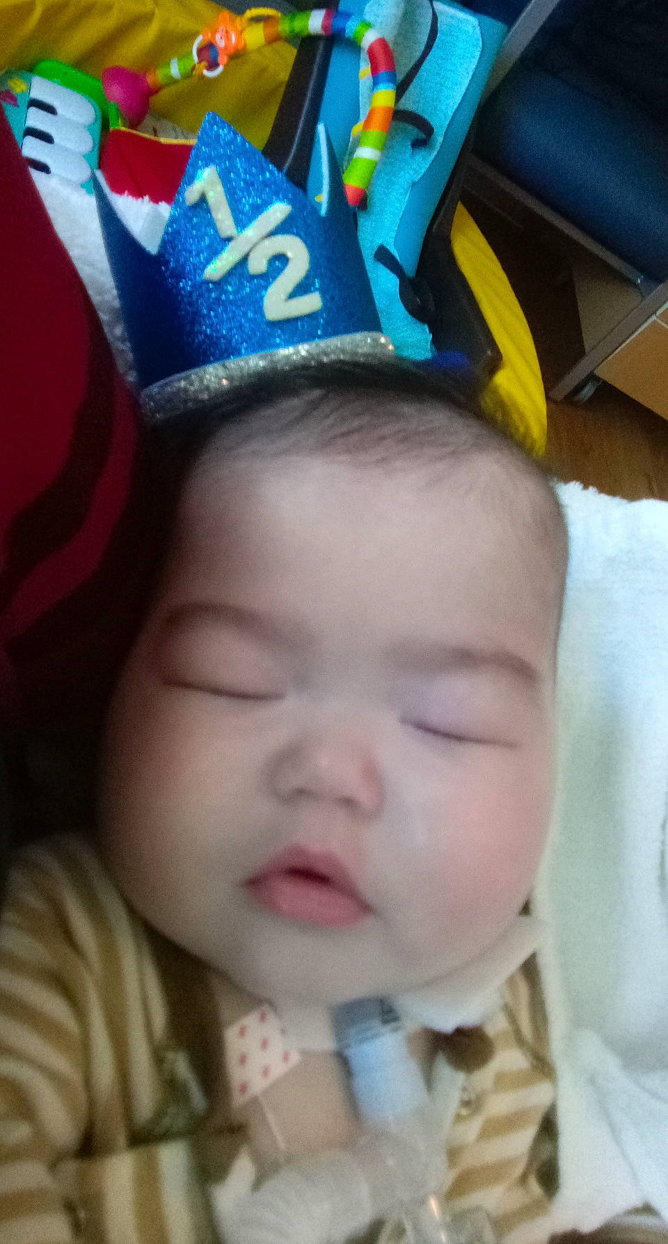 Neo is registered to the contest to win money with this photo: baby, baby_toddler_clothing, blue, cap, cheek, chin, eye, eyebrow, face, finger, happy, iris, lip, nose, party_hat, person, pink, skin, textile, toddler