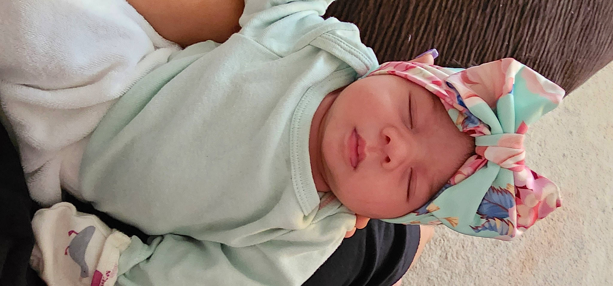 Emberly is registered to the contest to win money with this photo: baby, baby_products, baby_sleeping, baby_toddler_clothing, cheek, comfort, eye, eyelash, glasses, hand, headgear, headwear, human_body, lip, mouth, nail, nose, person, skin, sleeve