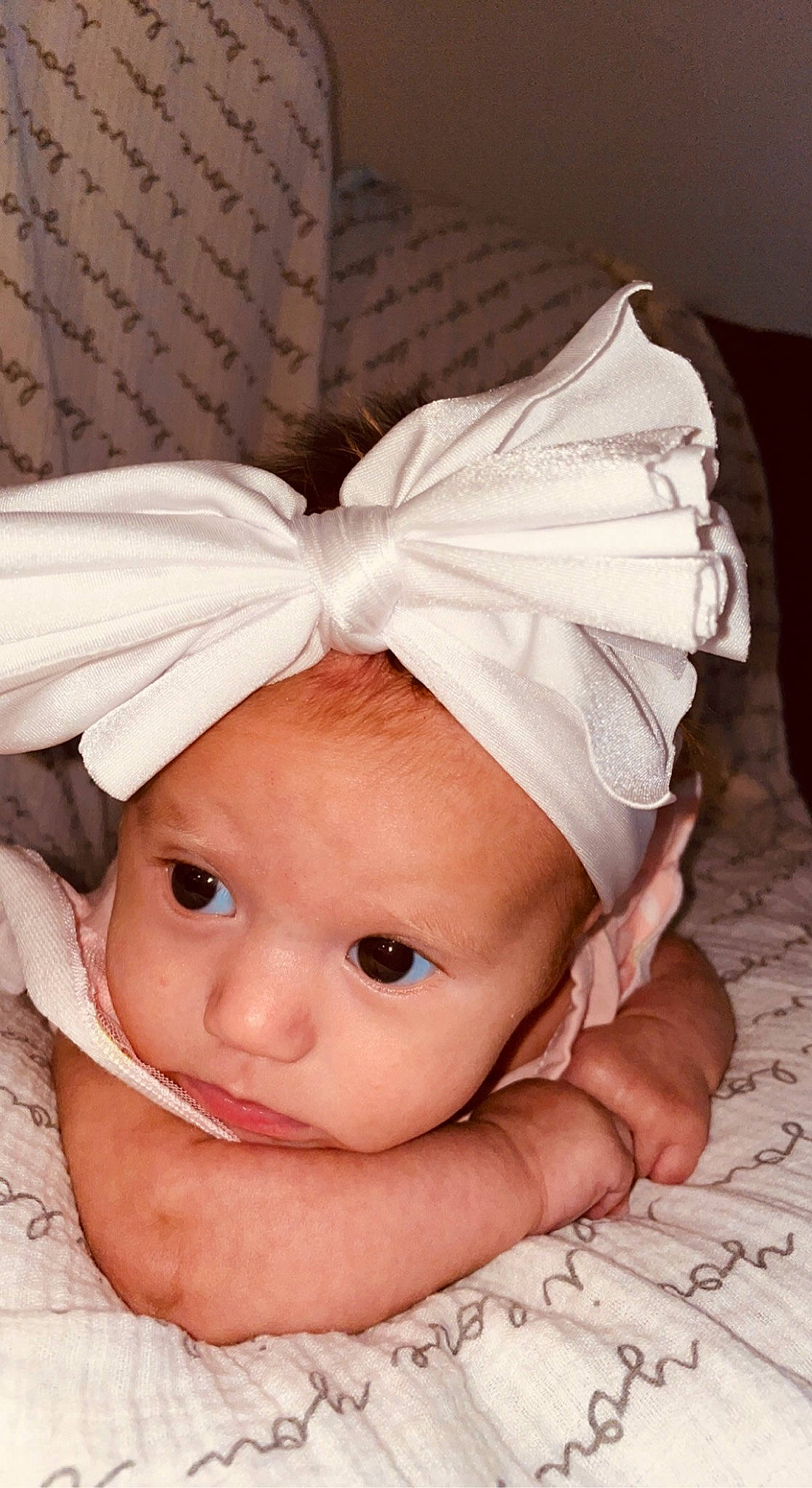 Xyla is registered to the contest to win money with this photo: baby, baby_sleeping, baby_toddler_clothing, cap, child, comfort, costume_accessory, costume_hat, fashion_accessory, fur, hair_accessory, happy, head, headband, headgear, headpiece, headwear, linens, peach, person