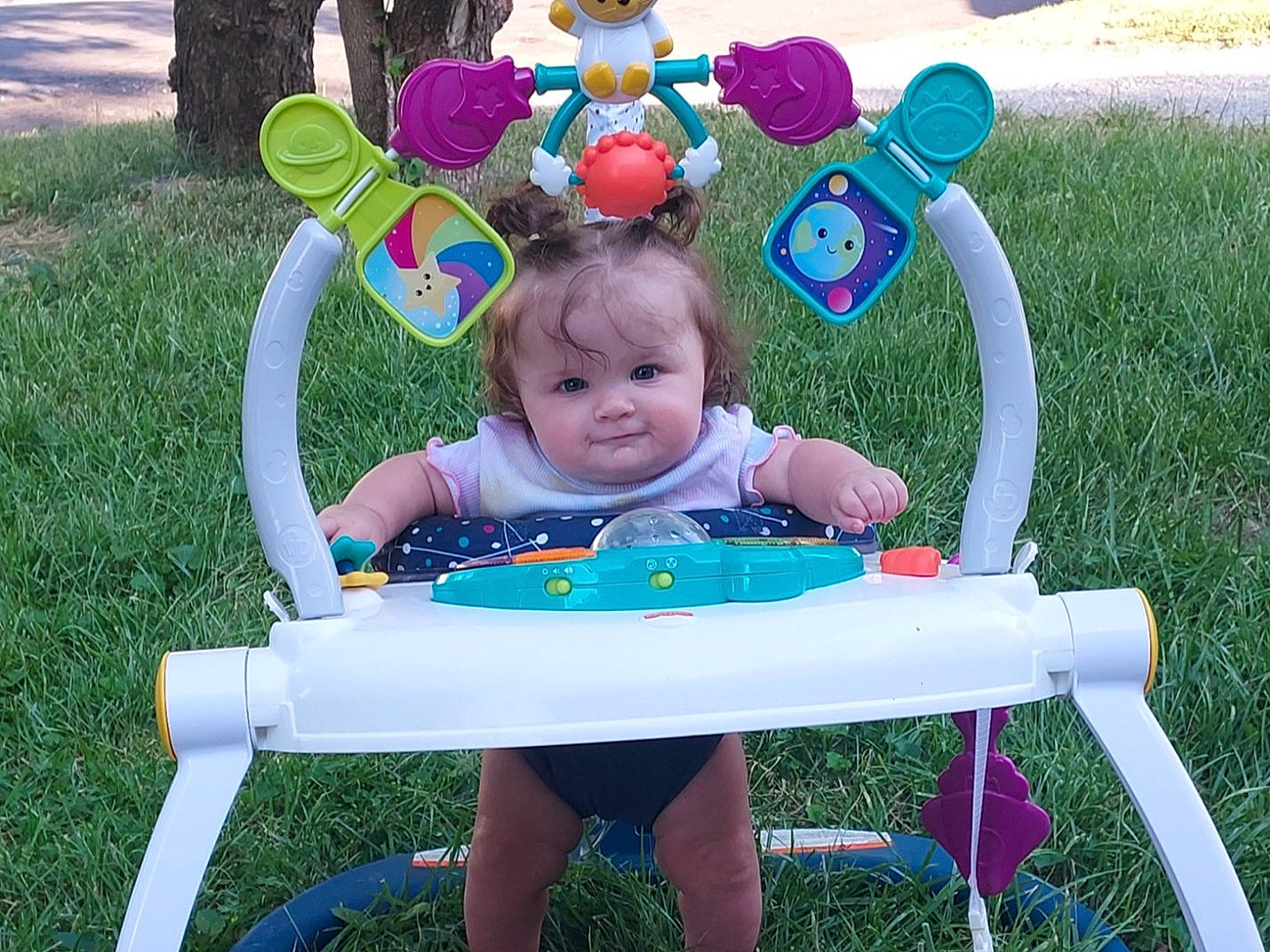 Emberly is registered to the contest to win money with this photo: baby_toddler_clothing, chair, event, fun, furniture, grass, green, happy, lawn, leisure, outdoor_furniture, people_in_nature, person, play, product, public_space, recreation, sharing, sitting, table