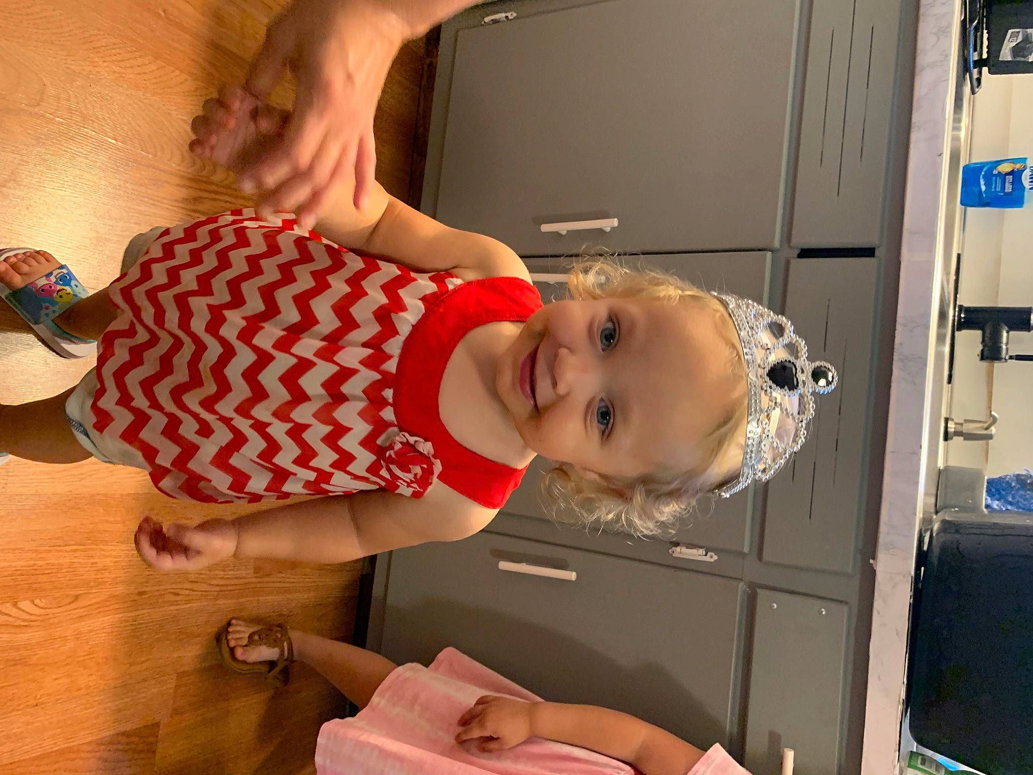 Ellie joined the competition — help win amazing prizes! baby, baby_toddler_clothing, child, elbow, eyewear, flooring, fun, happy, hat, human_leg, joy, machine, person, refrigerator, room, smile, toddler, wood