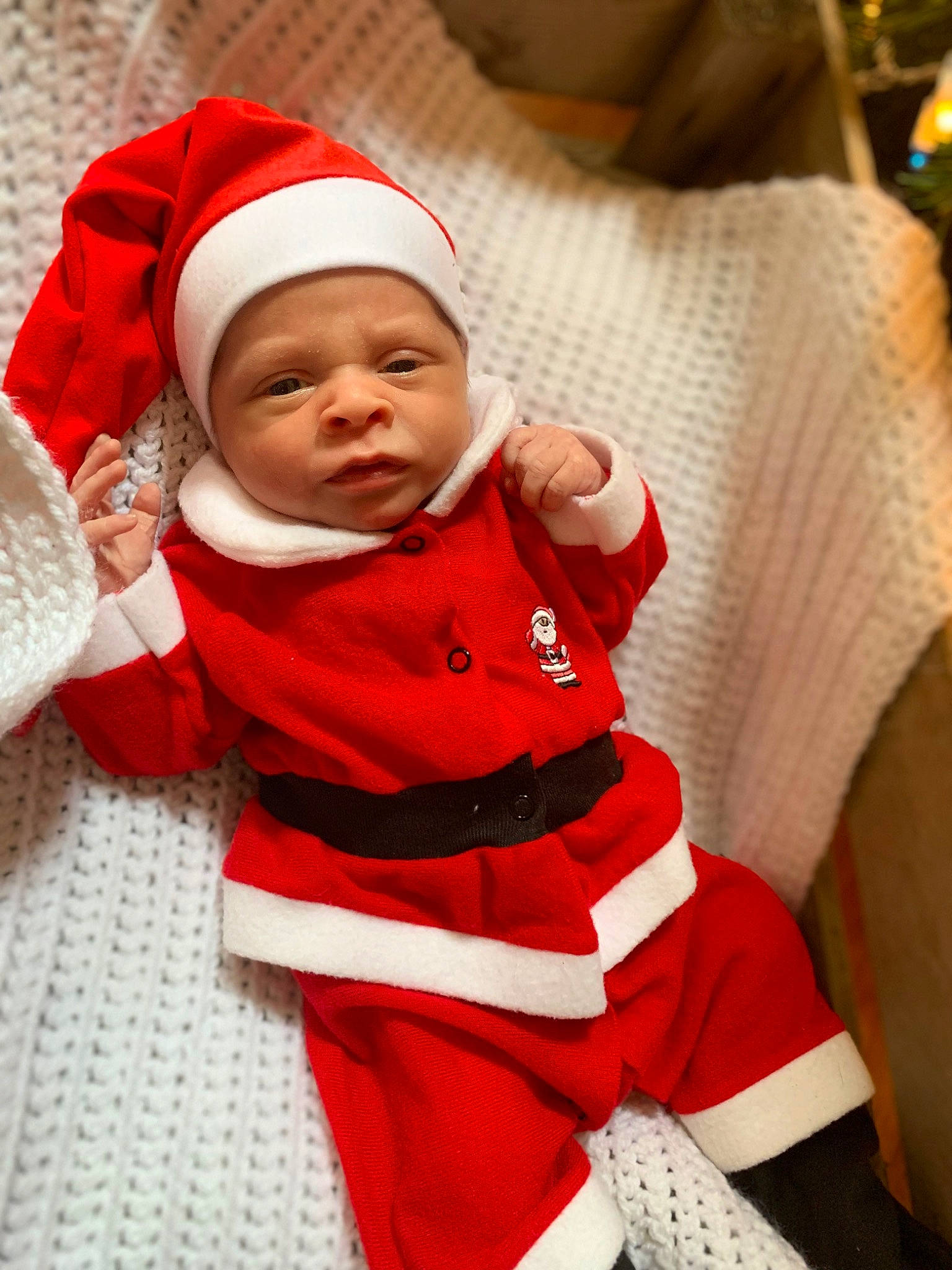 Brenden is registered to the contest to win money with this photo: baby, baby_sleeping, baby_toddler_clothing, carmine, child, christmas, christmas_eve, comfort, couch, event, fictional_character, happy, headwear, holiday, human_body, linens, person, santa_claus, skin, sleeve