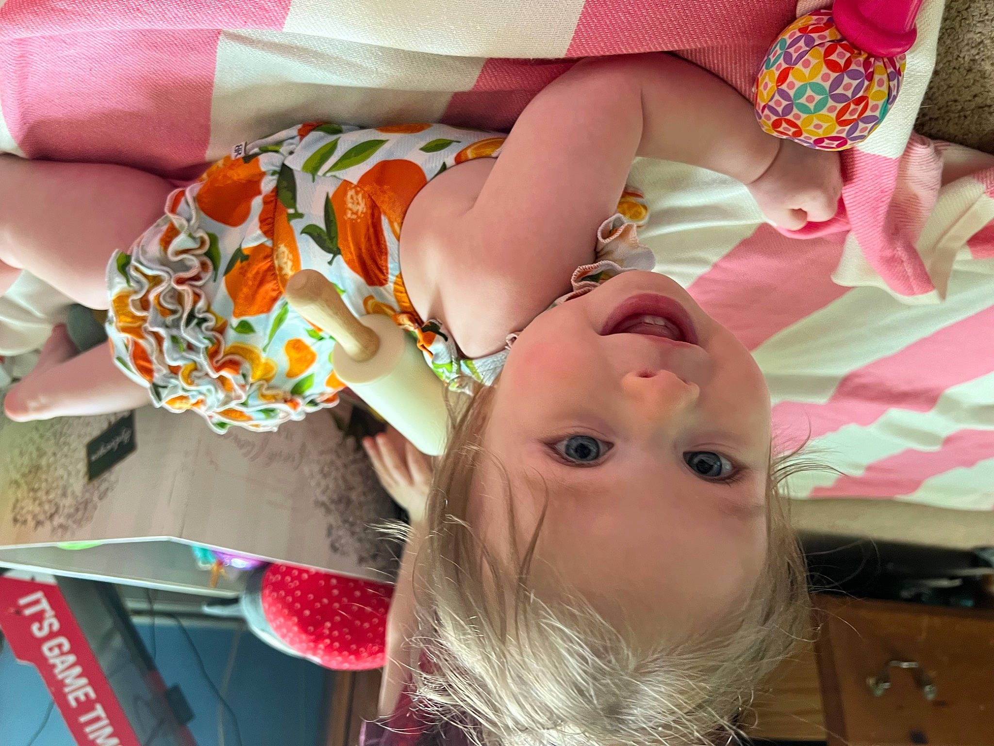 Miriam is registered to the contest to win money with this photo: baby, child, costume_hat, eyelash, fashion_accessory, finger, fun, happy, hat, headgear, helmet, mouth, nail, party_supply, pattern, peach, person, pink, sweetness, thigh