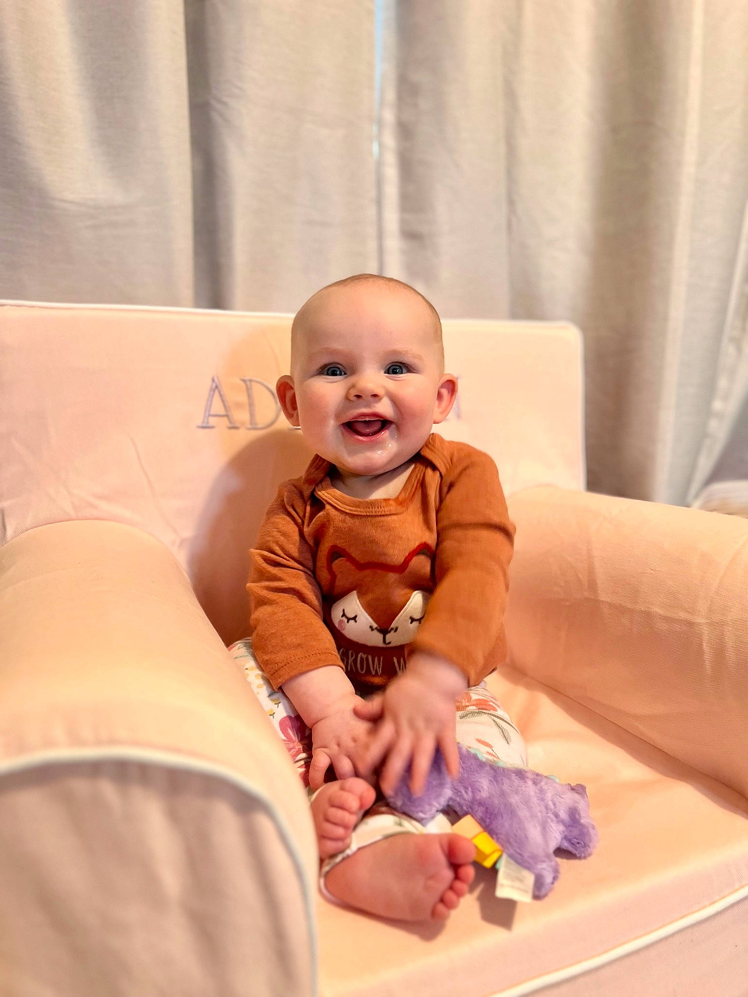 Addilynn is registered to the contest to win money with this photo: baby, baby_toddler_clothing, child, comfort, couch, curtain, flash_photography, flooring, fun, happy, joy, knee, person, room, sitting, skin, sleeve, smile, t_shirt, toddler
