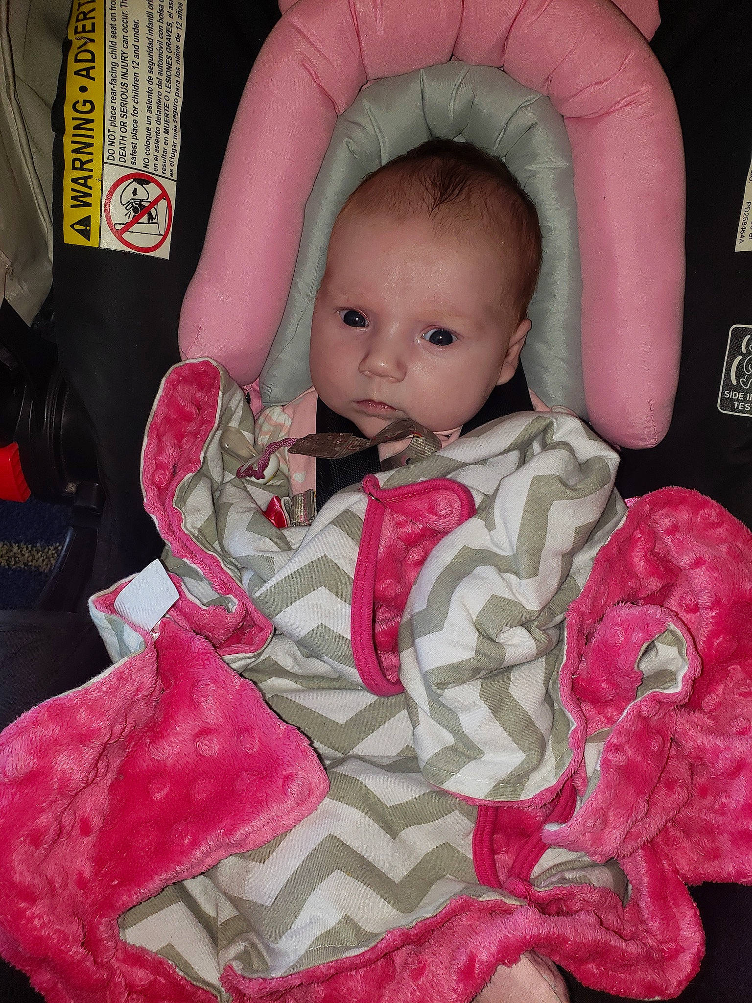 Bree is registered to the contest to win money with this photo: arm, baby, baby_products, baby_toddler_clothing, cheek, dress, eye, eyebrow, eyelash, human_body, iris, lip, neck, nose, outerwear, person, pink, product, skin, sleeve