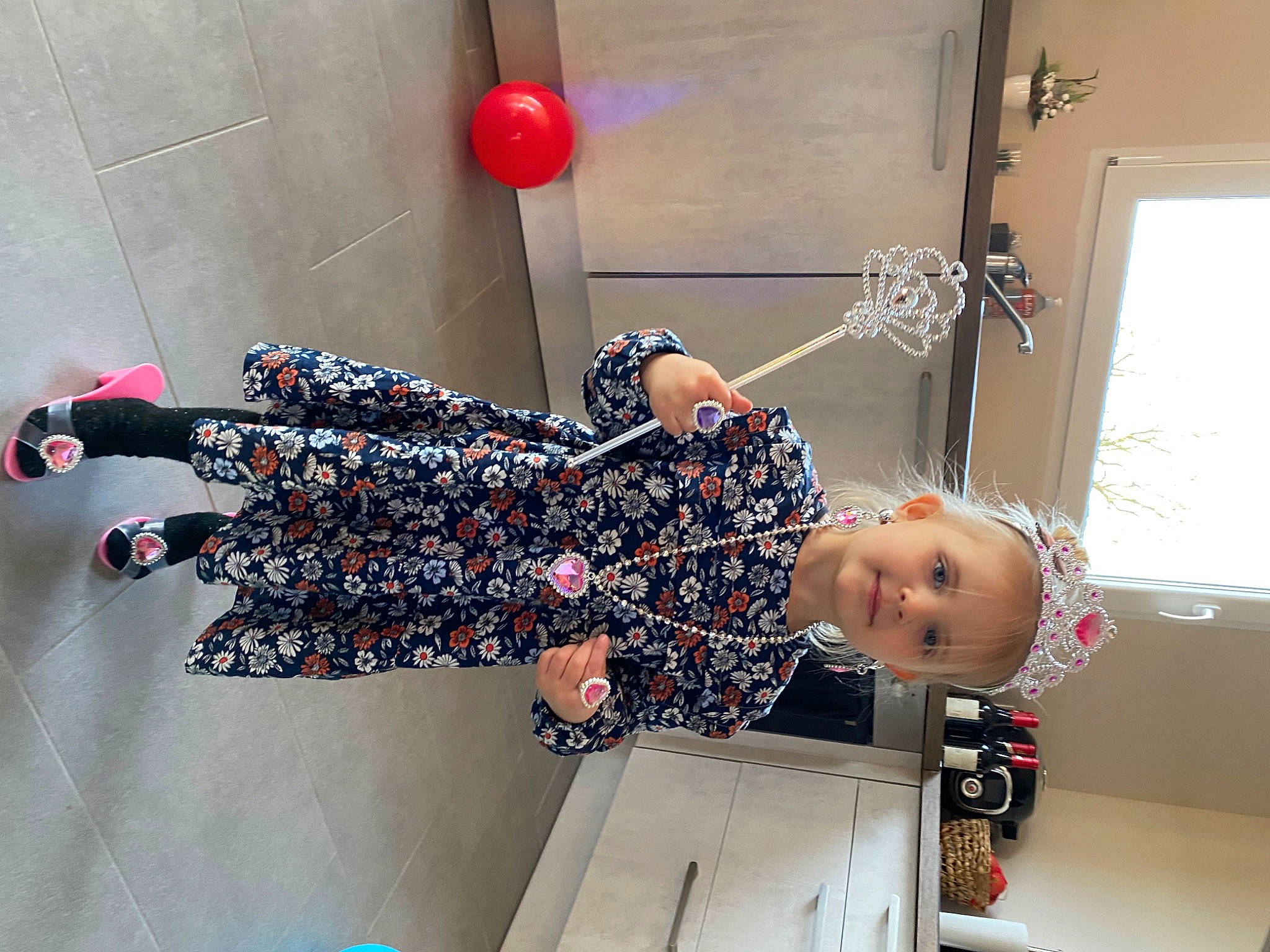Noémie participe au concours pour gagner de l'argent avec cette photo : baby, baby_toddler_clothing, child, dress, fashion_design, flooring, fun, happy, human_leg, knee, pattern, person, room, sandal, smile, thigh, toddler, visual_arts, waist, window