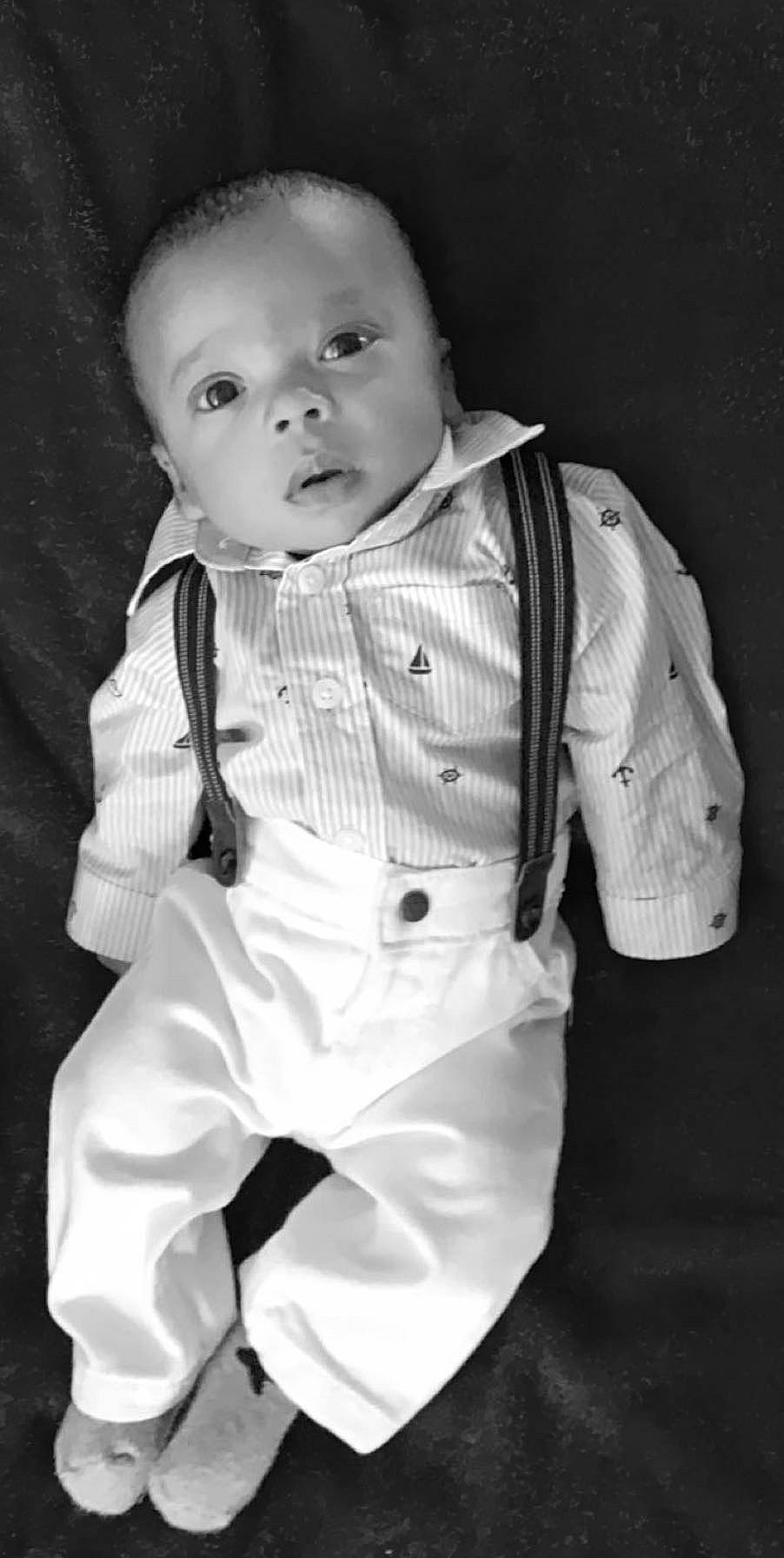 Deangelo is registered to the contest to win money with this photo: baby, black, black_and_white, cheek, child, child_model, head, monochrome, monochrome_photography, person, photograph, photography, portrait, portrait_photography, sitting, smile, standing, style, suit, toddler