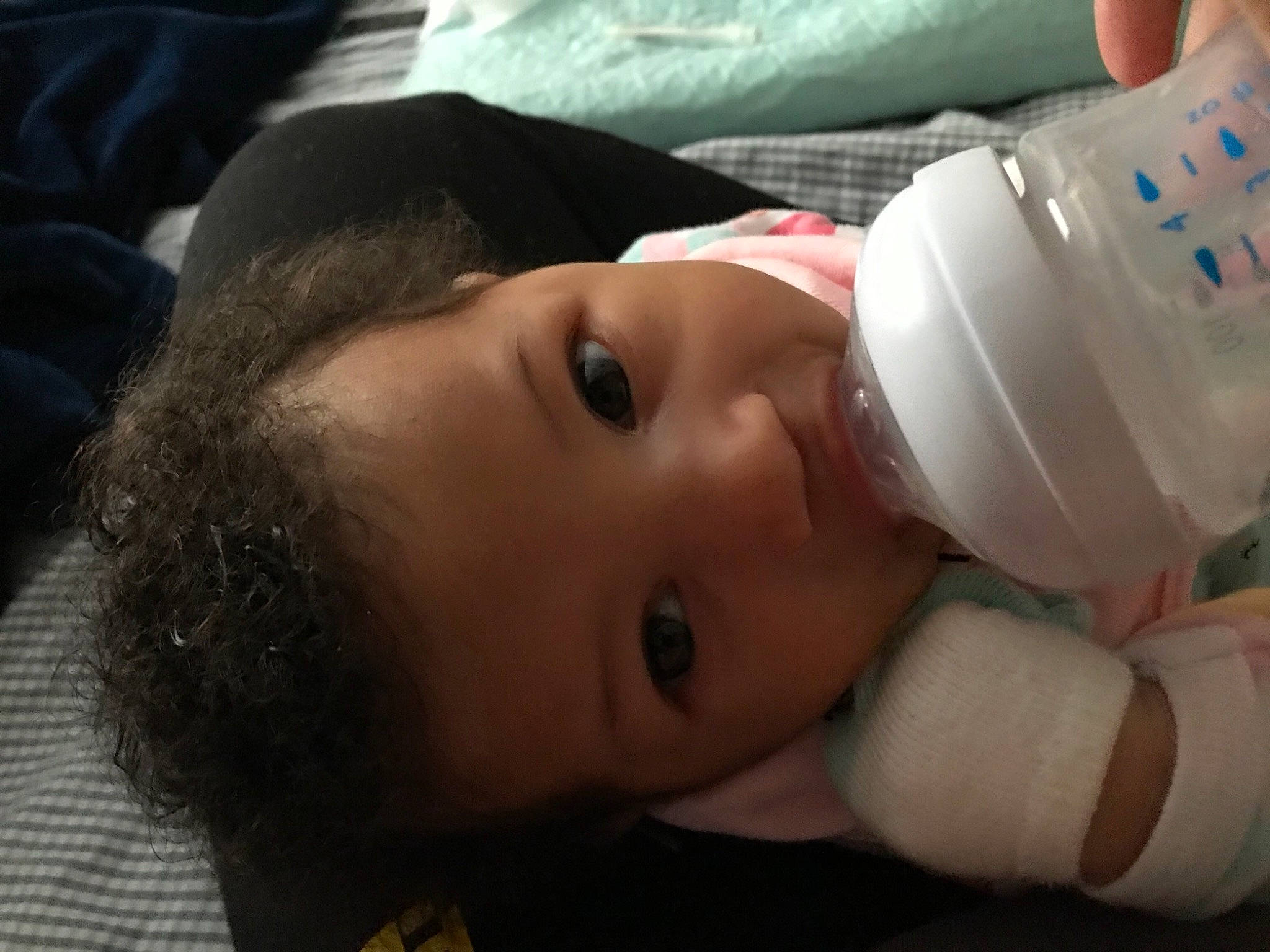 Farrah is registered to the contest to win money with this photo: baby, baby_bottle, baby_bottle_feeding, baby_products, baby_toddler_clothing, bottle, cheek, child, dairy, drinking, drinkware, grain_milk, infant_formula, milk, person, plant_milk, plastic_bottle, product, raw_milk, skin