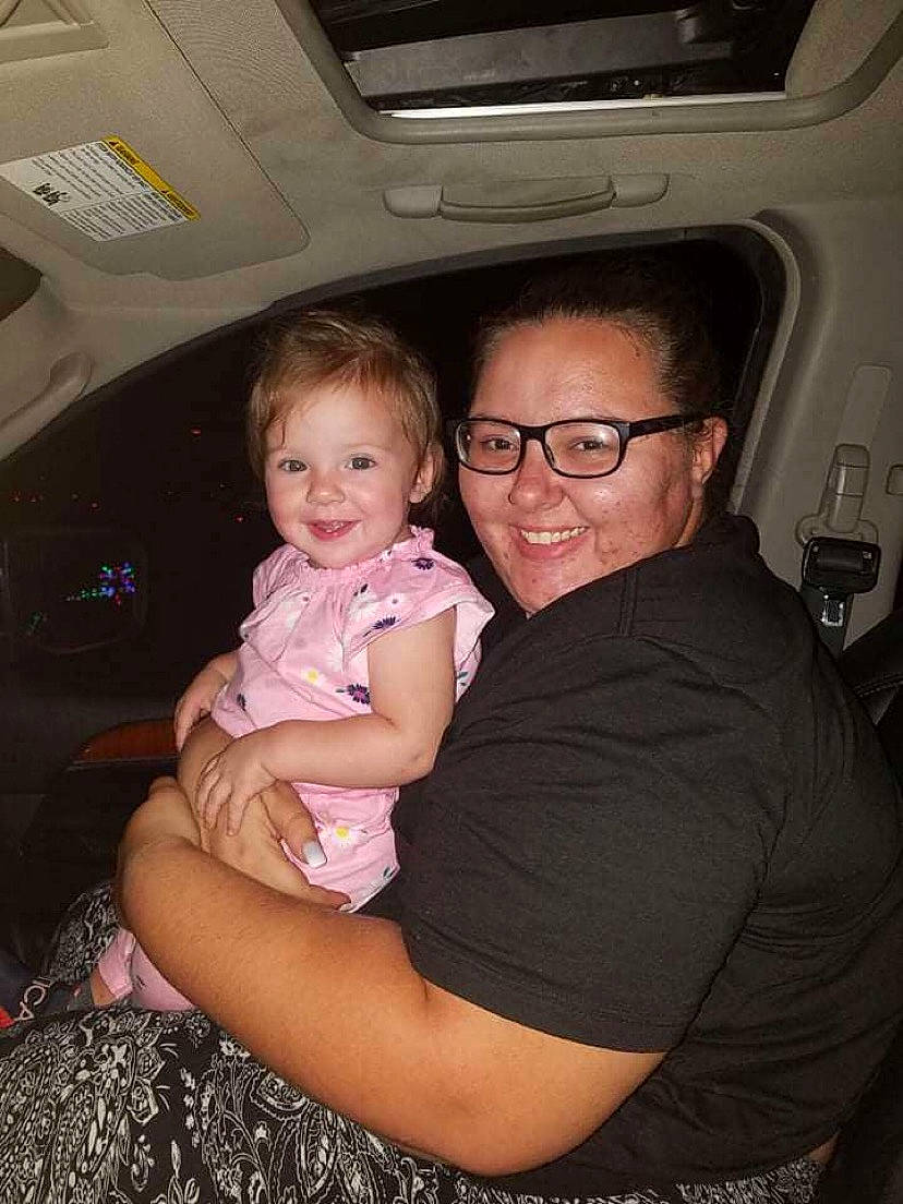 Selene is registered to the contest to win money with this photo: automotive_design, child, chin, clothing, comfort, face, flash_photography, fun, glasses, happy, iris, joy, lap, person, skin, smile, t_shirt, thumb, toddler, trunk