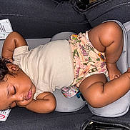 Adore joined the competition — help win amazing prizes! baby, sleeping, car_seat, curly_hair, infant, child, cute, relaxed, clothing, floral, shorts, skin, peaceful, rest, child_seat, indoors, young, person, comfort, nap