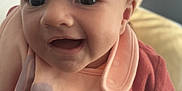 Nahïa participe au concours pour gagner de l'argent avec cette photo : apparel, baby, bib, child, clothing, cozy, cute, expression, eyes, face, happy, human, indoor, infant, mouth, portrait, skin, smiling, warm, young