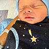 Noah joined the competition — help win amazing prizes! newborn, baby, sleeping, blanket, stars, moon, hat, infant, closeup, person, hospital, arm, skin, peaceful, cute, child, wrapped, cozy, resting, indoors