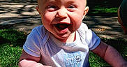 Franklin is registered to the contest to win money with this photo: baby, building, child, clothing, concrete, daylight, expression, face, grass, greenery, hand, happy, head, nature, outdoor, person, playful, smiling, sunlight, toddler