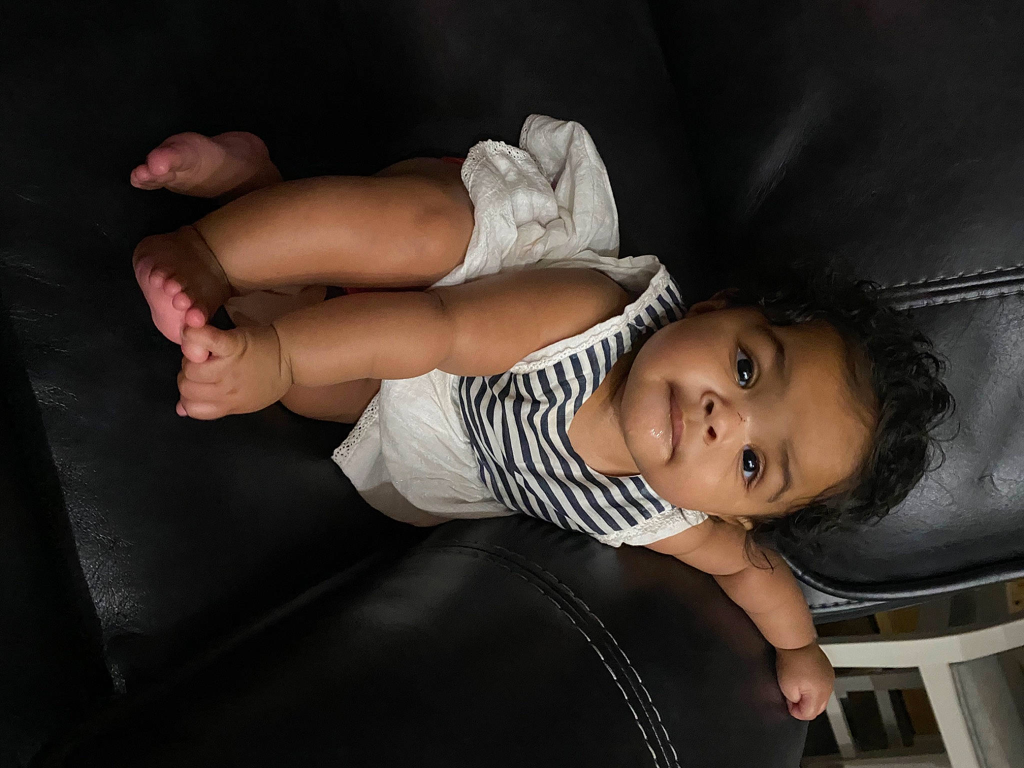 Kenzlie is registered to the contest to win money with this photo: arm, baby, black_hair, child, flash_photography, hand, leg, muscle, person, photo_shoot, photography, sitting, skin, toddler