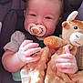 Kazdyn joined the competition — help win amazing prizes! baby, child, car_seat, pacifier, plush_toy, smiling, happy, hair, mohawk, infant, clothing, seatbelt, cute, hand, face, indoors, soft_toy, comfort, toddler, childhood