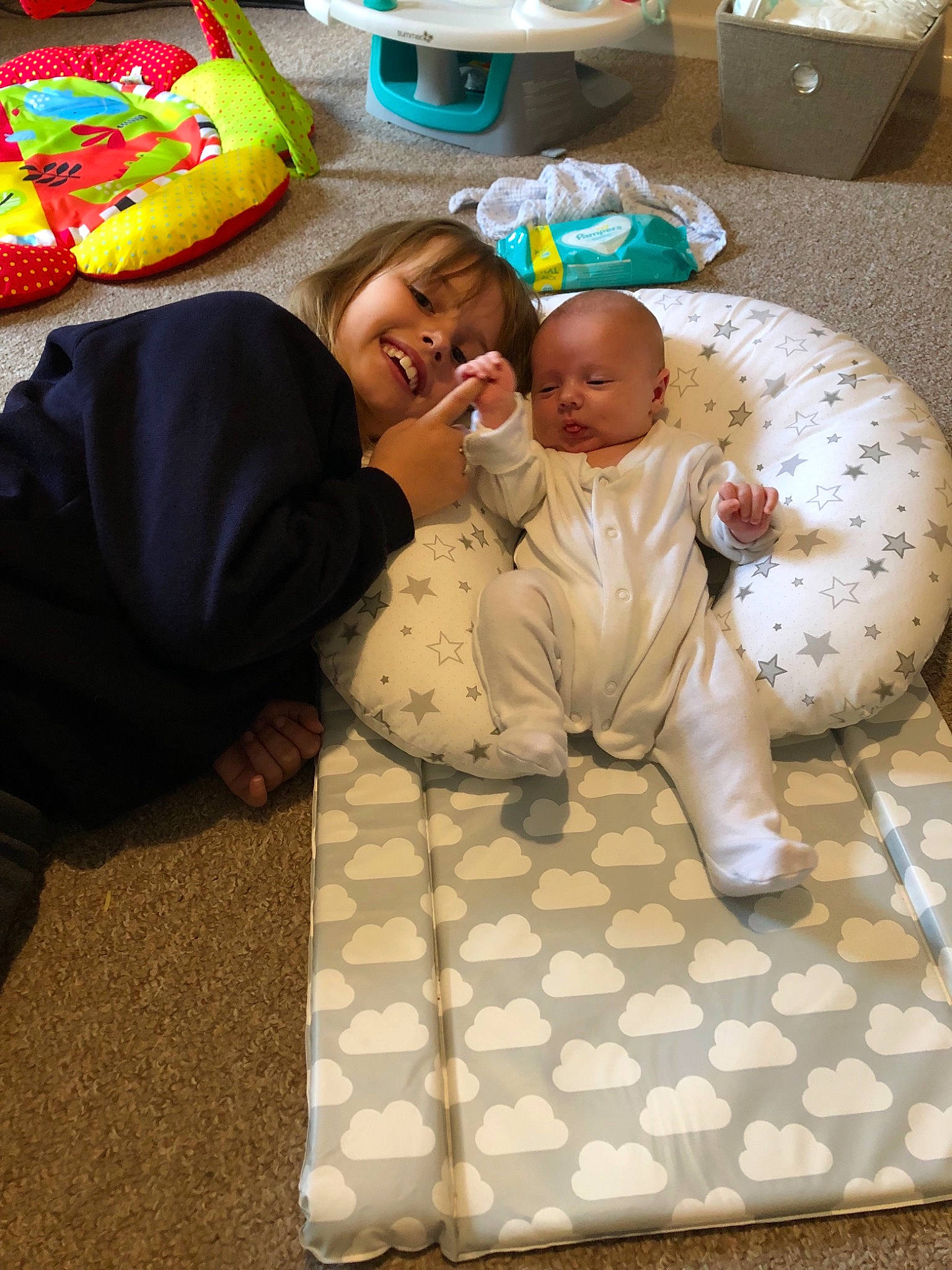 Aimee is registered to the contest to win money with this photo: baby, child, floor, flooring, fun, games, joy, person, play, room, smile, toddler