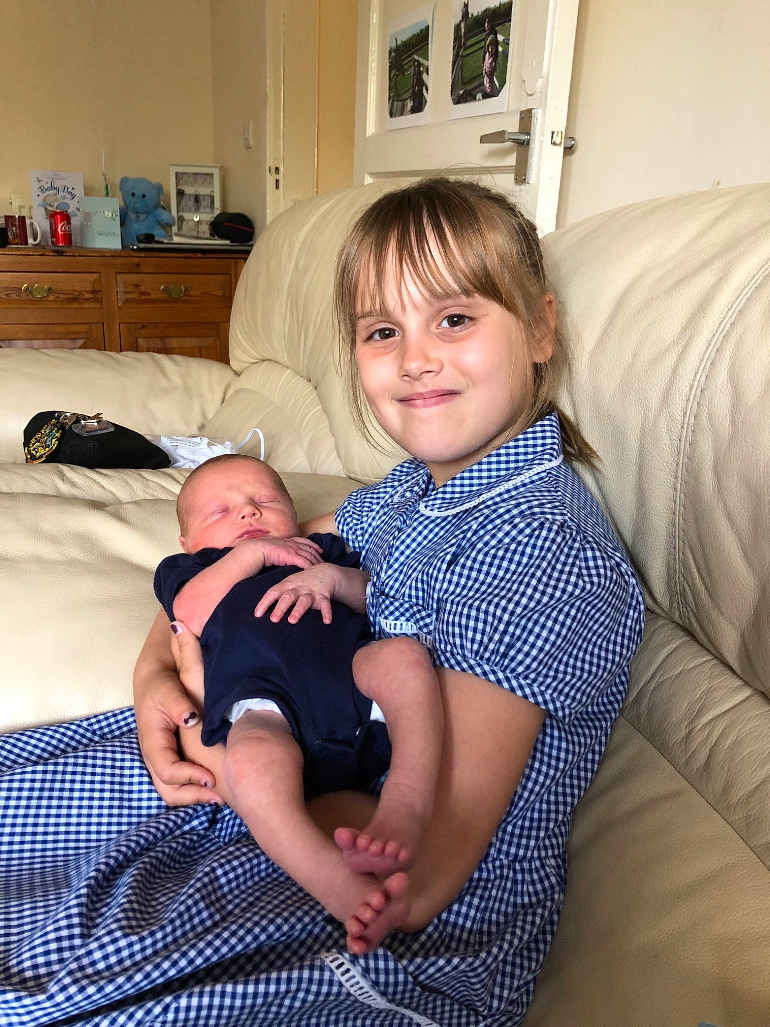 Aimee is registered to the contest to win money with this photo: arm, baby, birth, child, comfort, family, furniture, joy, lap, leg, people, person, room, sitting, toddler, vacation