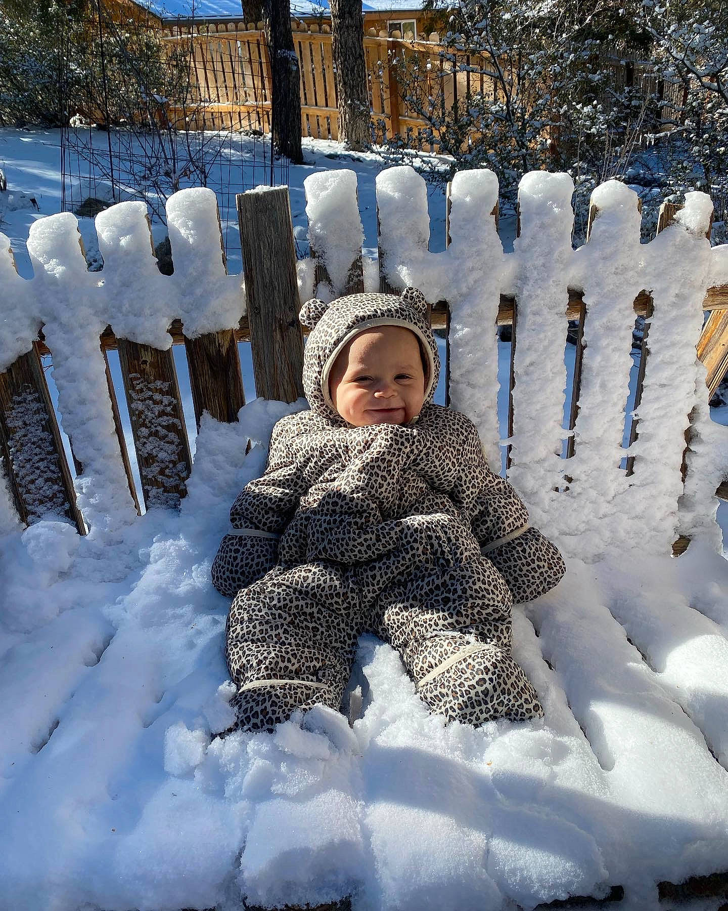 Joy is registered to the contest to win money with this photo: electric_blue, eye, face, freezing, frost, fun, ice_cap, joy, leisure, people_in_nature, person, playing_in_the_snow, precipitation, recreation, sitting, sky, slope, smile, snow, toddler
