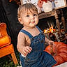 toddler, child, baby, portrait, standing, smiling, denim_overalls, autumn, pumpkin, fall_decor, orange_leaves, chair, vase, flowers, indoor, cozy, home_decor, white_blanket, blue_eyes, photography