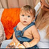 Hunter is registered to the contest to win money with this photo: baby, child, infant, caregiver, portrait, sitting, indoors, sofa, blanket, orange, denim, overalls, toy, seashell, blue_eyes, brown_hair, blonde_hair, cozy, family, smiling