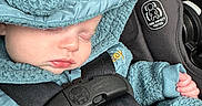 Kaysen is registered to the contest to win money with this photo: baby, bear_ears, blue_clothing, bundle, car_interior, car_seat, child, close_up, cute, hand, hood, infant, peaceful, portrait, safety_label, seatbelt, secured, sleeping, soft_texture, transport