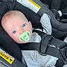 Kaysen is registered to the contest to win money with this photo: baby, blue_eyes, car_interior, car_seat, child, closeup, cute, gray_clothing, head_support, indoor, infant, pacifier, person, portrait, safety, seat_belt, sitting, straps, warning_label, young_child