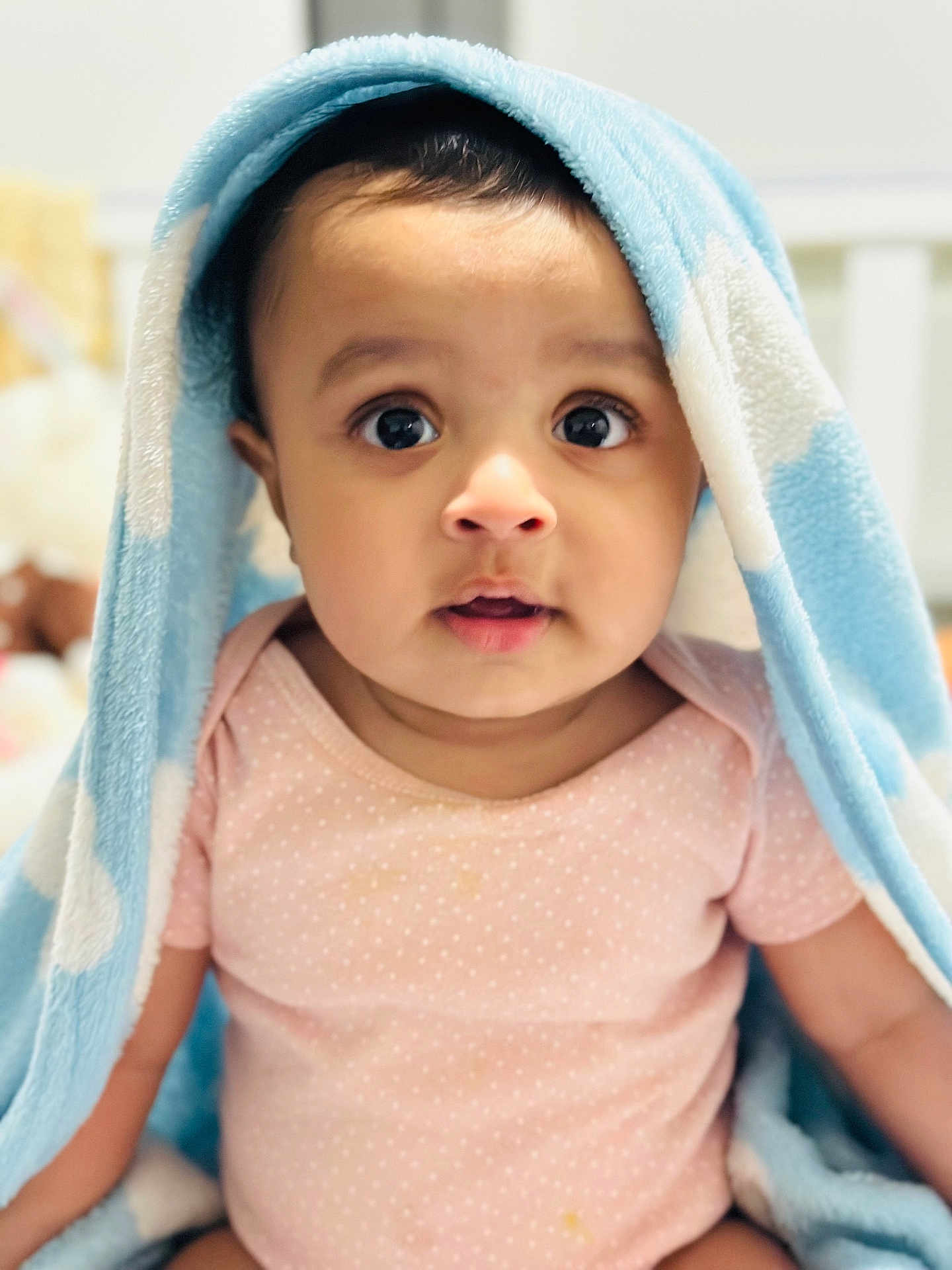 Punardeep Singh joined the competition — help win amazing prizes! baby, child, blanket, blue, pink, onesie, polka_dot, face, eyes, indoor, portrait, cute, soft, infant, clothing, expression, head, skin, person, warm