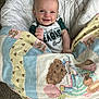 James is registered to the contest to win money with this photo: baby, smiling, blanket, teddy_bear, drool, philadelphia_eagles, infant, bedding, cute, child, happy, portrait, indoor, clothing, carpet, person, head, face, hand, soft
