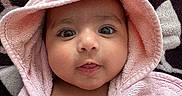 Tegh is registered to the contest to win money with this photo: baby, child, pink_towel, hood, blanket, face, portrait, closeup, cute, infant, skin, eyes, expression, soft_texture, warm, resting, indoors, newborn, head, person
