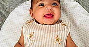 Tegh joined the competition — help win amazing prizes! baby, child, clothing, cushion, cute, eyes, fabric, face, floral, hand, happy, indoors, infant, lying_down, mouth, person, portrait, skin, smiling, striped