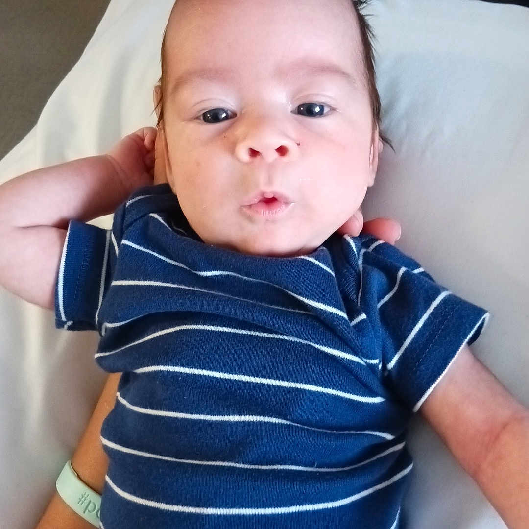 Abraxas joined the competition — help win amazing prizes! baby, blue_onesie, child, cute, expression, face, hair, hand, indoors, infant, lying_down, newborn, person, portrait, resting, skin, striped_clothing, support, wristband, young_child