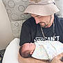 Abraxas joined the competition — help win amazing prizes! alphabet_print, baby, blanket, bucket_hat, chain_necklace, closeup, cushioned_chair, family, hat, holding, indoor, infant, man, newborn, pattern, peaceful, person, portrait, sleeping, tshirt