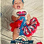 Aurora is registered to the contest to win money with this photo: accessories, baby, bodypart, can, clapperboard, clothing, costume, face, finger, glove, hand, happy, hat, head, laughing, newborn, person, photography, portrait, tin