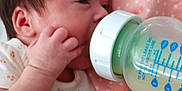 Sophia joined the competition — help win amazing prizes! baby, infant, feeding, bottle, milk, blanket, hand, clothing, cute, person, newborn, bed, pink, white, sleepwear, closeup, face, resting, comfort, indoors