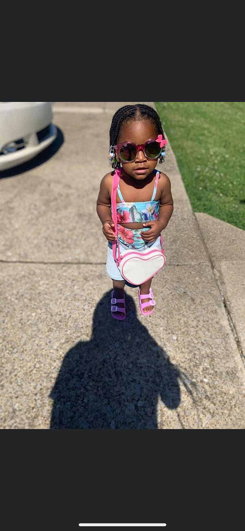 Janilah is registered to the contest to win money with this photo: asphalt, baby_toddler_clothing, child, cool, electric_blue, eyewear, fun, goggles, grass, hairstyle, happy, leisure, magenta, person, pink, recreation, street_fashion, sunglasses, tints_and_shades, toddler
