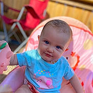 Meliiah joined the competition — help win amazing prizes! baby, blue_eyes, toy, baby_chair, outdoor, sunlight, playing, child, cute, smiling, toddler, clothing, pink, blue_shirt, face, person, seat, fence, red_chair, happy
