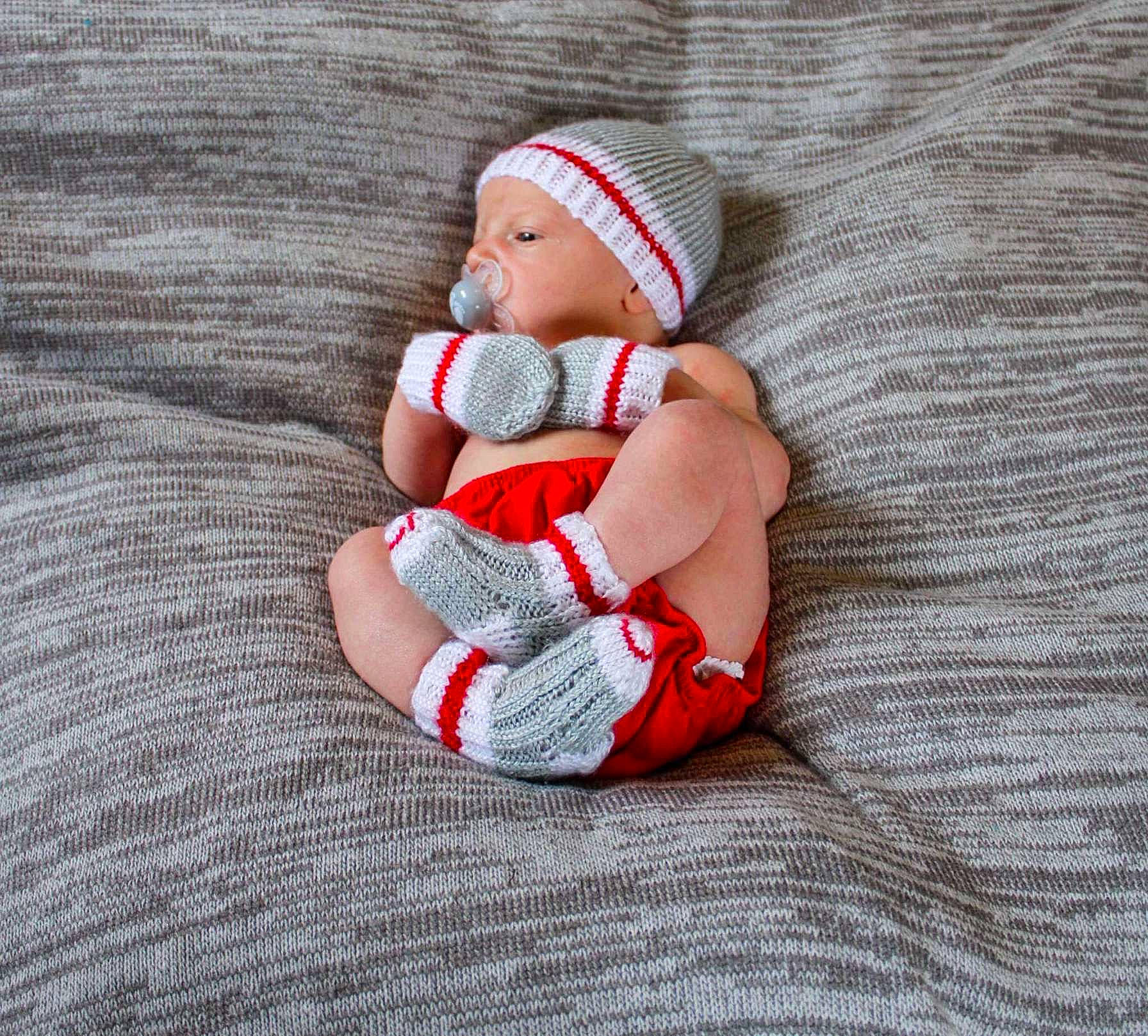 Lincoln joined the competition — help win amazing prizes! arm, baby, baby_sleeping, baby_toddler_clothing, cap, comfort, finger, foot, hand, headwear, human_body, lap, leg, linens, pattern, person, sleeve, sock, textile, thigh