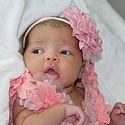 Amya is registered to the contest to win money with this photo: baby, infant, pink, flower_headband, blanket, lace, close_up, portrait, cute, newborn, child, soft, wrapped, hand, face, expression, indoors, skin, young, headwear