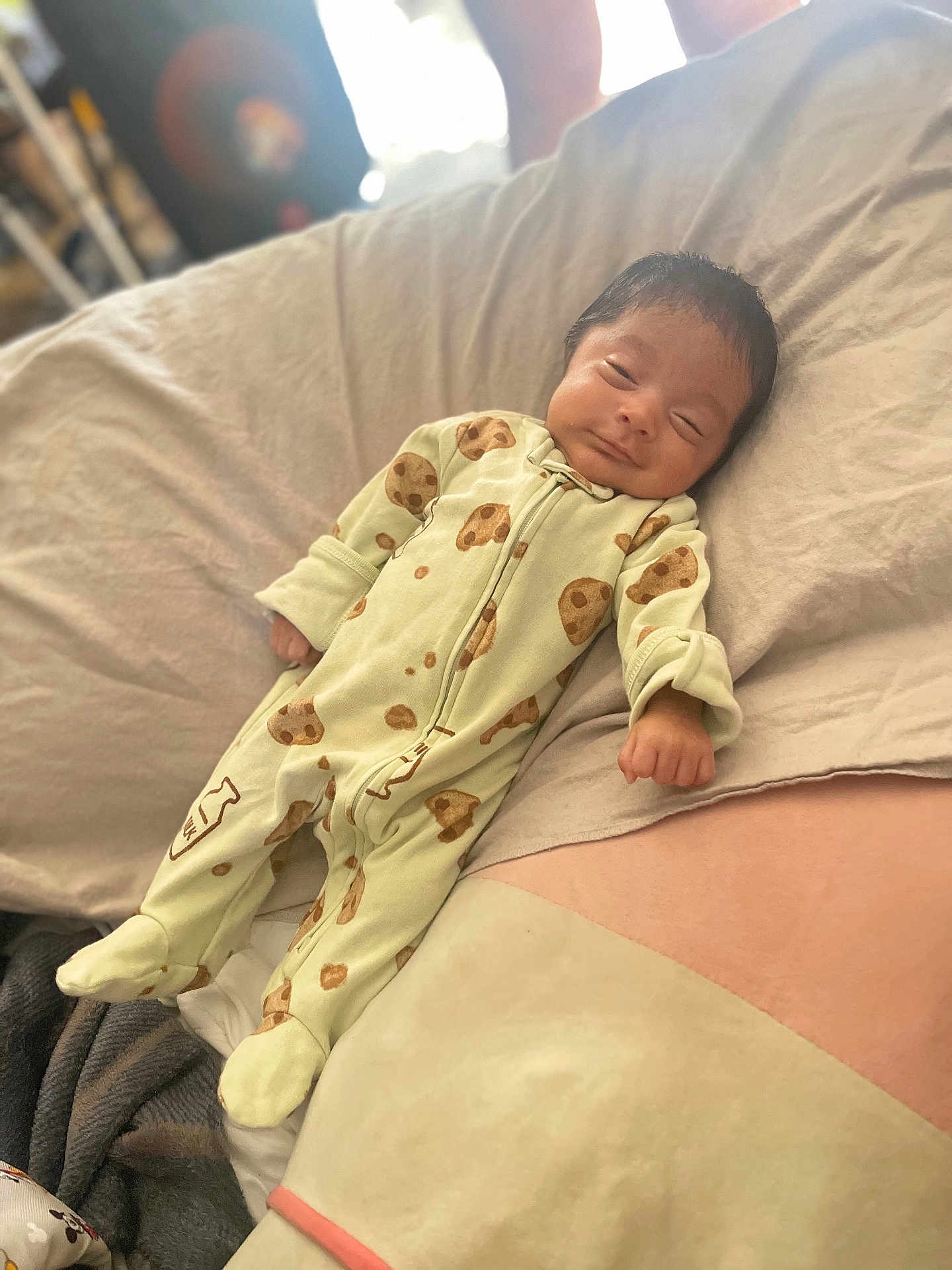 Andres joined the competition — help win amazing prizes! baby, infant, sleepwear, onesie, bed, blanket, pillow, sleeping, smiling, cute, child, indoor, soft, resting, cozy, person, face, human, cute_baby, peaceful