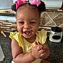 Kaylen joined the competition — help win amazing prizes! toddler, child, baby, smiling, happy, clapping, pink_bows, curly_hair, yellow_top, floral_shorts, kitchen_counter, kitchen, tiles, paper_towel, container, face, hands, person, indoor, cute