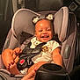 Kaylen is registered to the contest to win money with this photo: toddler, child, car_seat, smiling, baby, hair_buns, hair_accessories, clothing, seatbelt, foot, car_interior, happy, cute, sitting, infant, safety_harness, person, portrait, indoors, child_safety