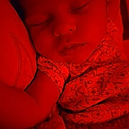 Zaloni is registered to the contest to win money with this photo: baby, sleeping, infant, red_light, blanket, floral_clothing, peaceful, closeup, face, portrait, resting, soft, cute, child, indoors, cozy, young, toddler, relaxing, nap