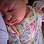 Zaloni joined the competition — help win amazing prizes! baby, sleeping, infant, onesie, floral_pattern, hand, face, peaceful, closeup, soft_lighting, child, cute, newborn, portrait, cozy, resting, pink, yellow, green, fabric