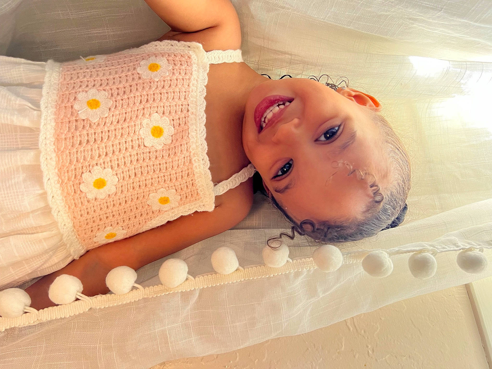 Ovie is registered to the contest to win money with this photo: baby, baby_products, baby_safety, baby_toddler_clothing, bathing, chest, child, comfort, eye, eyelash, face, flooring, happy, human_body, joy, linens, pattern, person, skin, sleeve