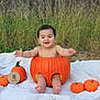 Noel is registered to the contest to win money with this photo: baby, pumpkin, blanket, outdoor, grass, smiling, infant, orange, milestone, nature, cute, celebration, autumn, person, child, face, feet, happy, seasonal, photography