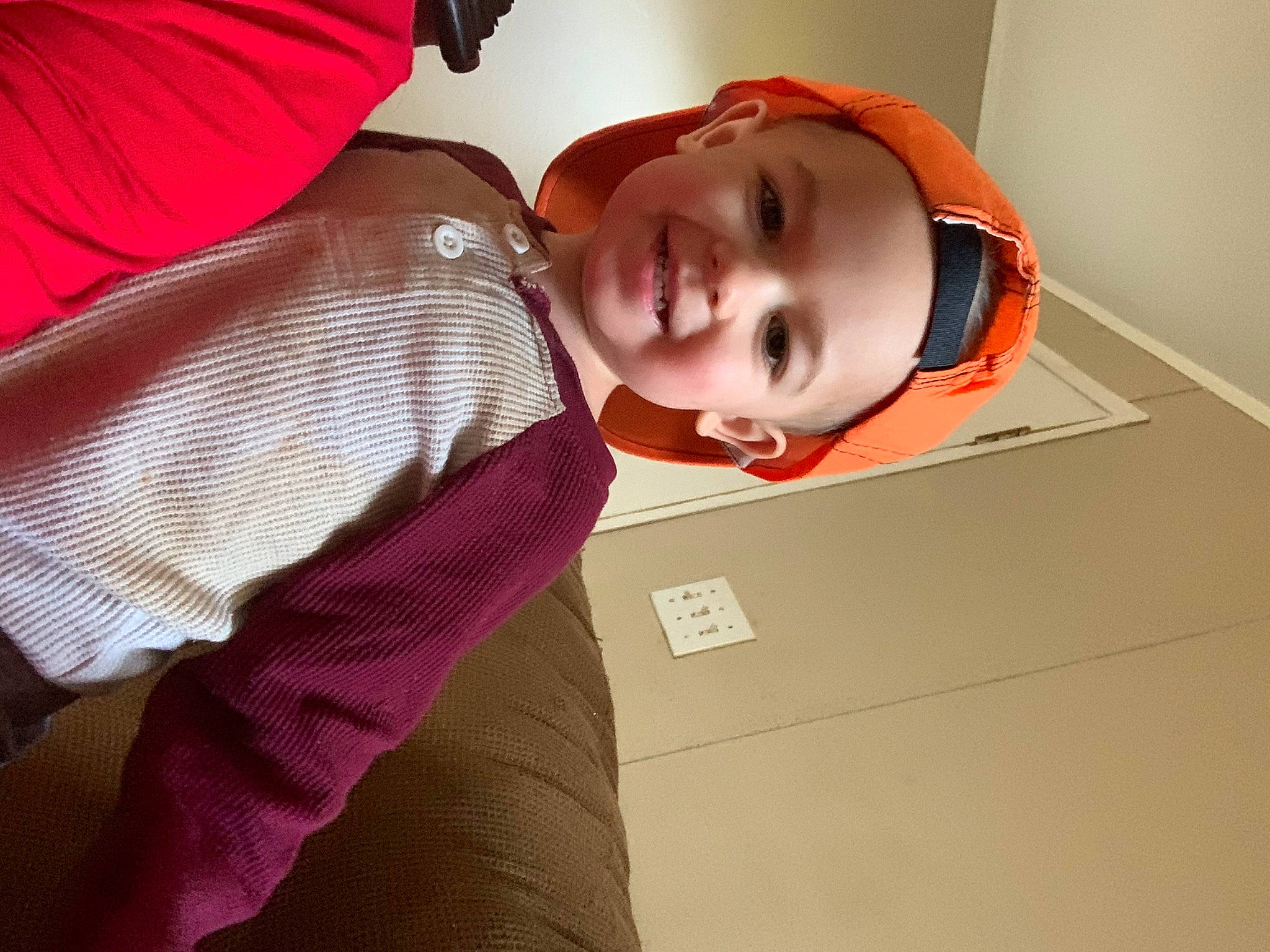 Lance is registered to the contest to win money with this photo: baby, cheek, comfort, eye, eyebrow, eyelash, eyewear, face, glasses, happy, headwear, jaw, joy, lip, mouth, neck, nose, person, red, sleeve