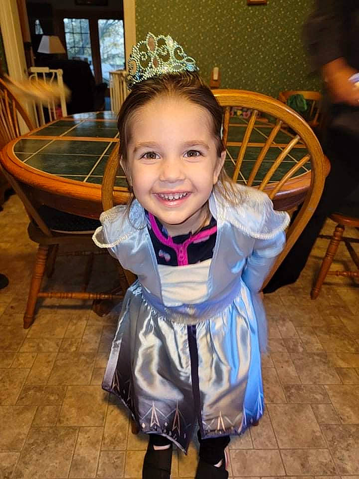 Melody joined the competition — help win amazing prizes! chair, child, crown, event, fashion_accessory, formal_wear, fun, furniture, hair_accessory, hairstyle, happy, headpiece, jewellery, joy, leisure, person, room, smile, standing, tiara