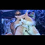Mango is registered to the contest to win money with this photo: cat, person, glasses, indoor, plush_toys, orange_cat, white_cat, fluffy, portrait, face, decor, tattoo, blue_lighting, stuffed_animals, hand, eyewear, furniture, room, pet, animal