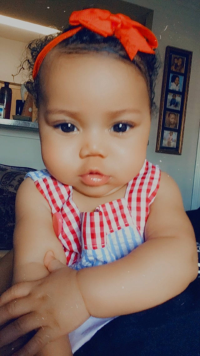 Janelle is registered to the contest to win money with this photo: baby, cheek, child, chin, eyebrow, face, forehead, hair_accessory, head, headband, lip, nose, person, skin, toddler